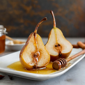 Gastritis-Friendly Baked Pears served on a pristine white plate, drizzled with a rich, amber-colored honey that pools around the base. The pears, cut side facing front, exhibit a perfectly caramelized surface with a sticky sheen, accentuated by the rustic backdrop that adds depth to this warm, inviting dessert.